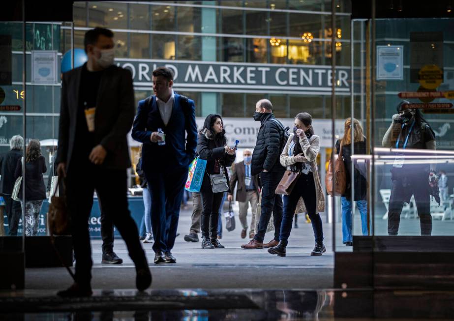 Conventiongoers walk in the courtyard during the Las Vegas Market at World Market Center Las Ve ...