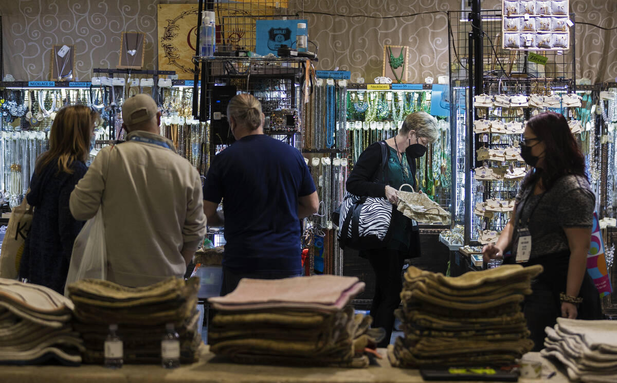 Conventiongoers browse at Ole Fashion Inc. during the Las Vegas Market at World Market Center L ...
