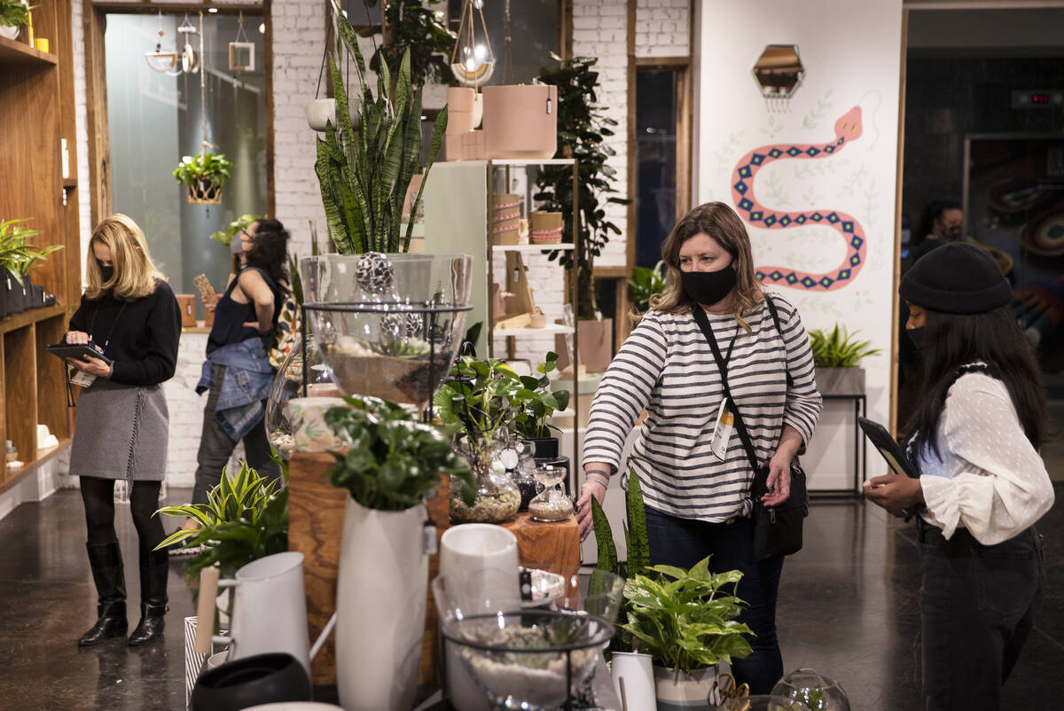 Tonya Harper, second from right, with Downtown Apothecary, shops at Accent Decor during the Las ...