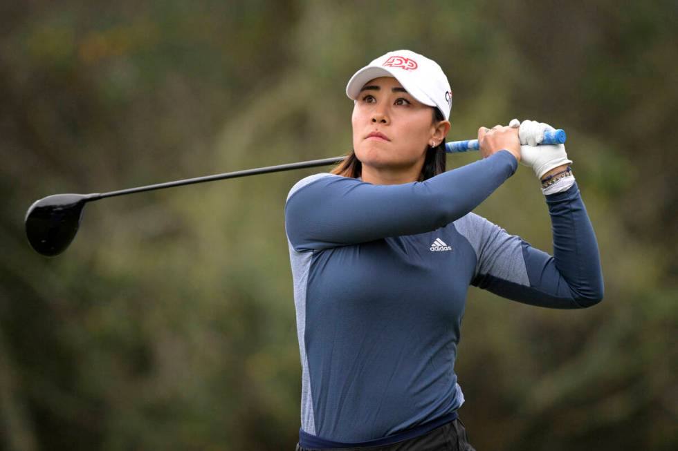 Danielle Kang watches her tee shot on the second hole during the third round of the Tournament ...