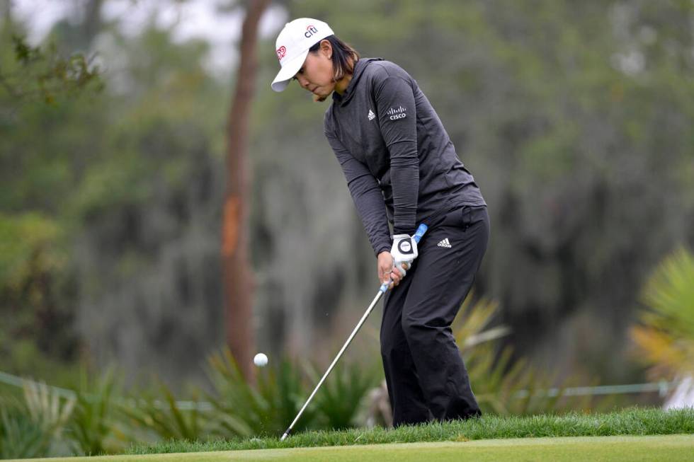 Danielle Kang chips onto the eighth green during the final round of the Tournament of Champions ...