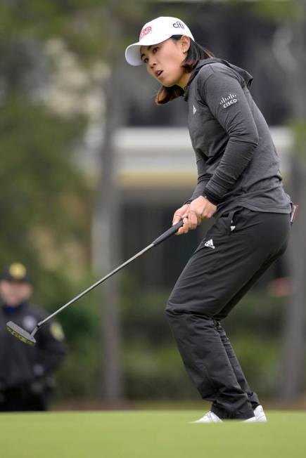 Danielle Kang reacts after barely missing a putt on the 17th green during the final round of th ...