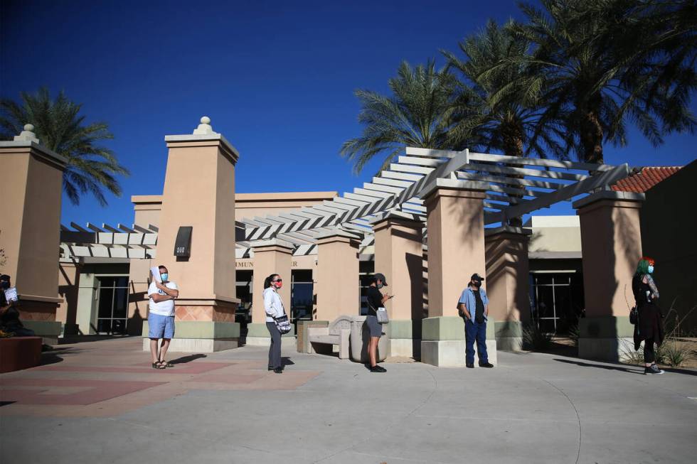 People line up to vote at the East Las Vegas Community Center polling location in Las Vegas, Sa ...