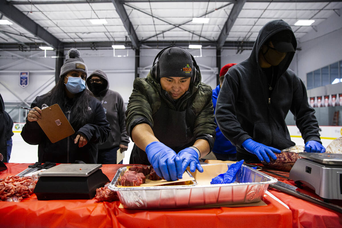 Rolando Ruiz, of Cedar Falls, Iowa, competes in the second round of the National Meat Cutter Ch ...