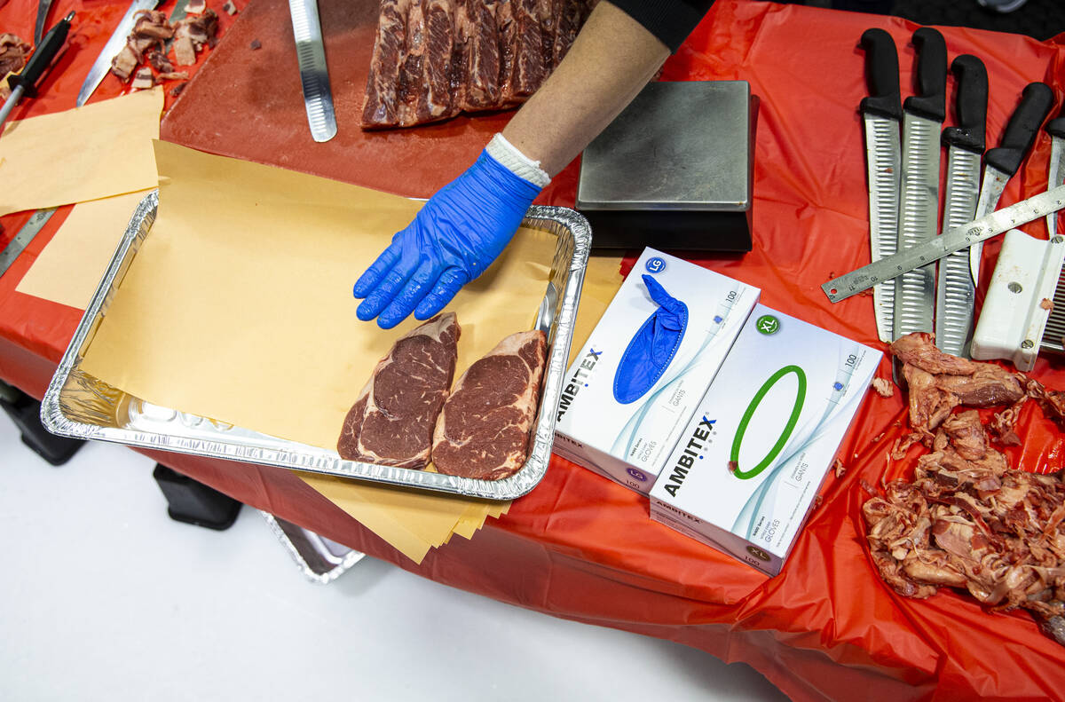 Butchers compete in the second round of the National Meat Cutter Challenge at Lifeguard Arena o ...