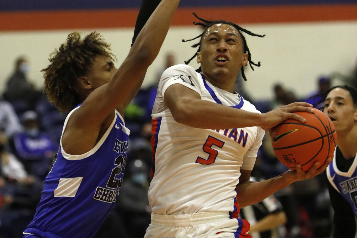 Bishop Gorman High School's Darrion Williams (5) shoots over Evangel Christian School's Christi ...