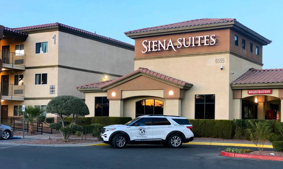 A security vehicle is parked near the front office at the Siena Suites extended-stay motel on B ...
