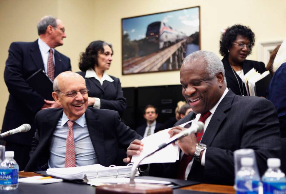 Supreme Court Associate Justices Stephen Breyer, left, and Clarence Thomas prepare to testify o ...
