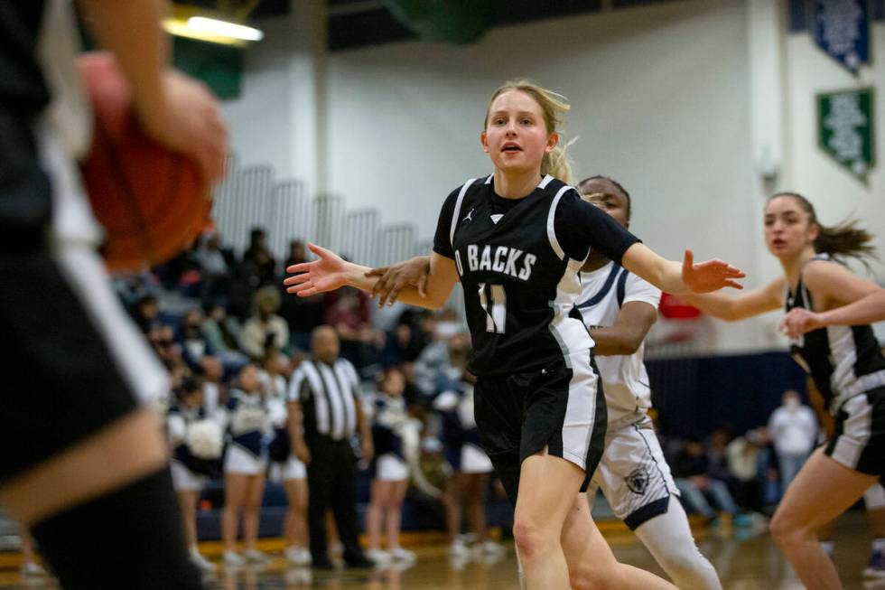 Desert Oasis’ Madelynn Shafrann (11) looks to receive a pass while Spring Valley’ ...