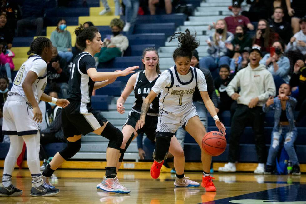 Spring Valley’s Janiyah Davis (1) gains control of the ball from Desert Oasis’ Ha ...