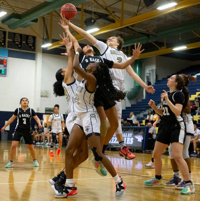 Spring Valley’s Grace Knox (2) blocks a shot by Desert Oasis’ Olivia Bigger (0) d ...