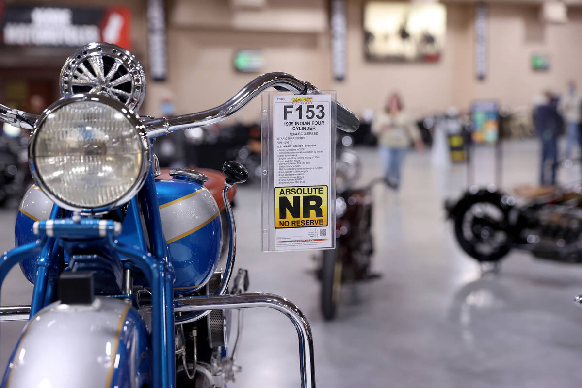 A 1939 Indian Four Cylinder, foreground, at the Mecum Auctions vintage and antique motorcycle a ...