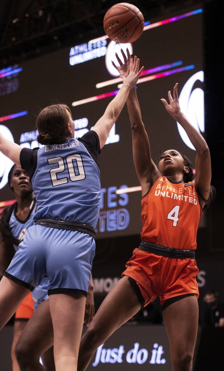 Team Russell’s Lexie Brown (4) shoots over Team Sims’ Kirby Burkholder (20) durin ...