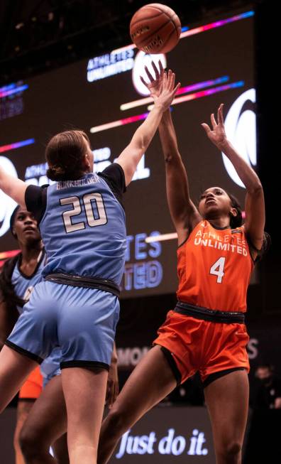 Team Russell’s Lexie Brown (4) shoots over Team Sims’ Kirby Burkholder (20) durin ...