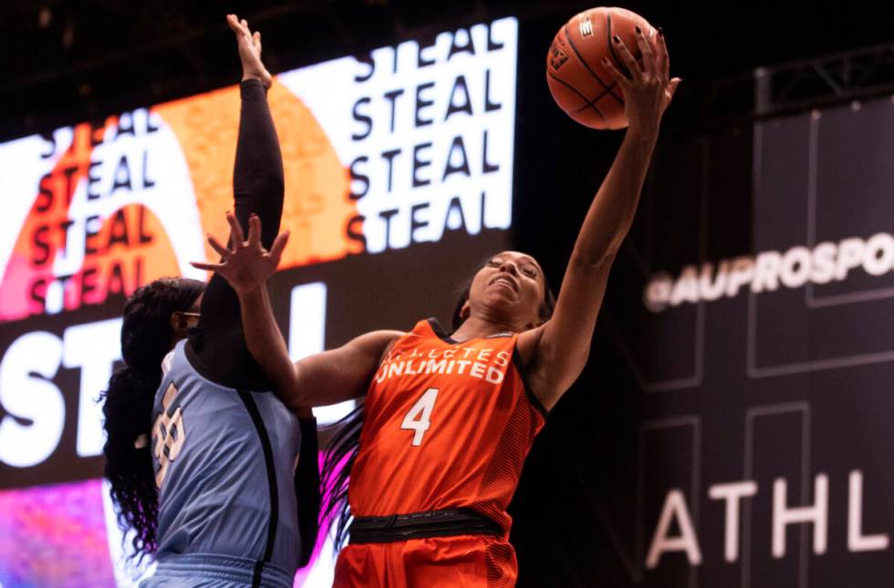 Team Russell’s Lexie Brown (4) drives to the rim over Team Sims’ Grace Hunter (36 ...