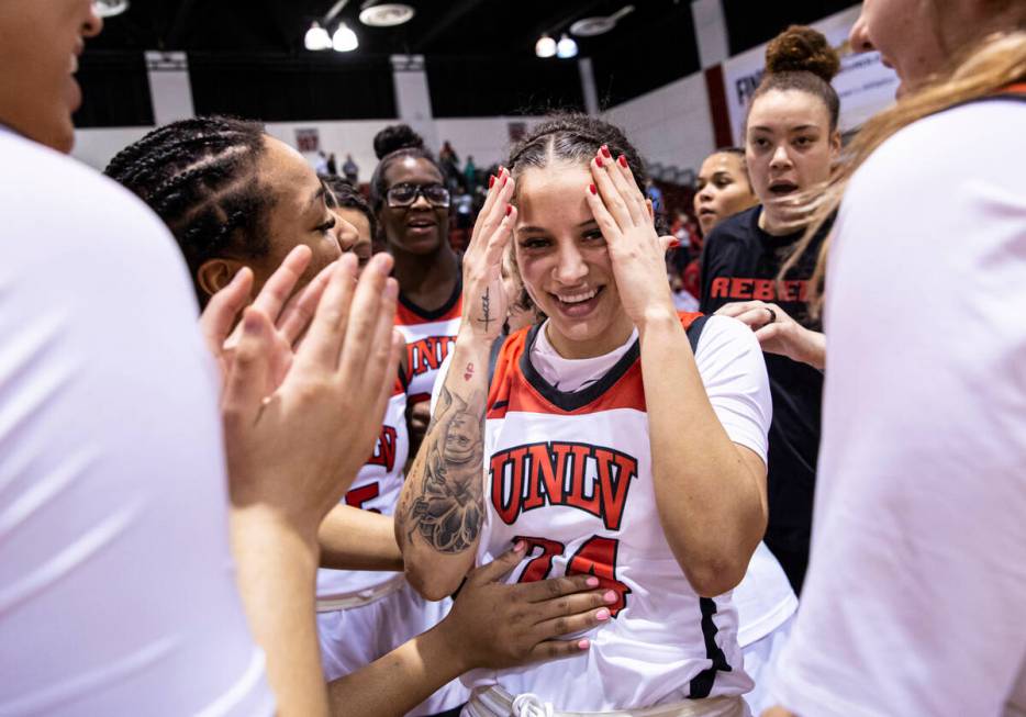 UNLV Lady Rebels guard Essence Booker (24) celebrates after reaching 1,000 career points and de ...