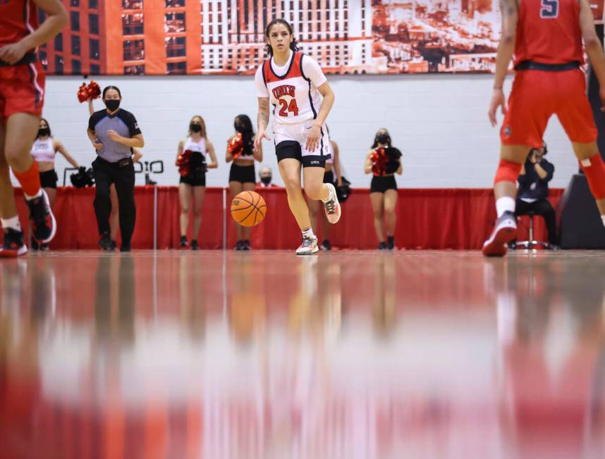 UNLV Lady Rebels guard Essence Booker (24) brings the ball up court against the New Mexico Lobo ...