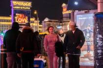 In this Dec. 31, 2021, file photo, ,New Year’s Eve crowds walk the Strip in Las Vegas.(Benjam ...