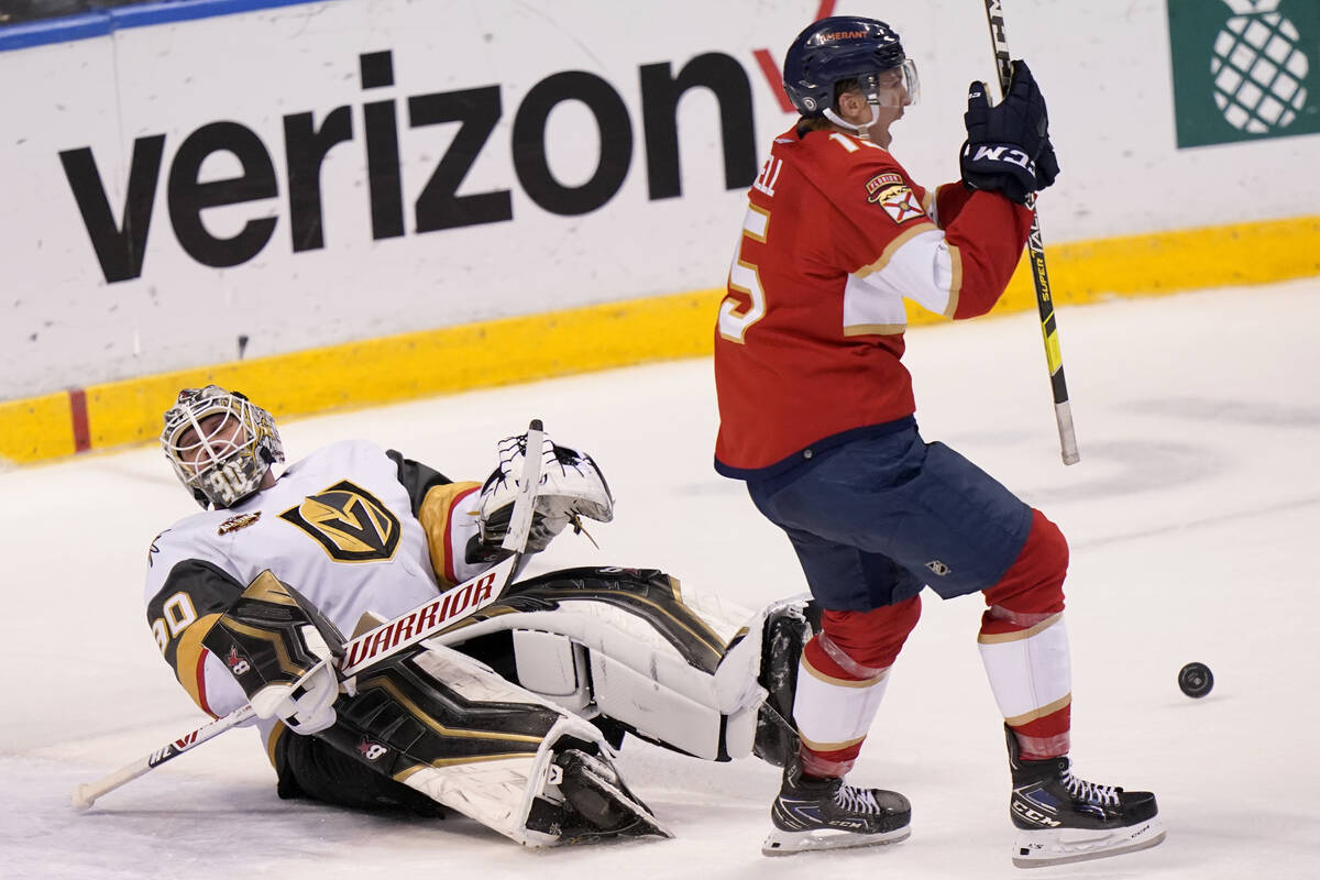 Florida Panthers center Anton Lundell, right, reacts after the puck got past Vegas Golden Knigh ...