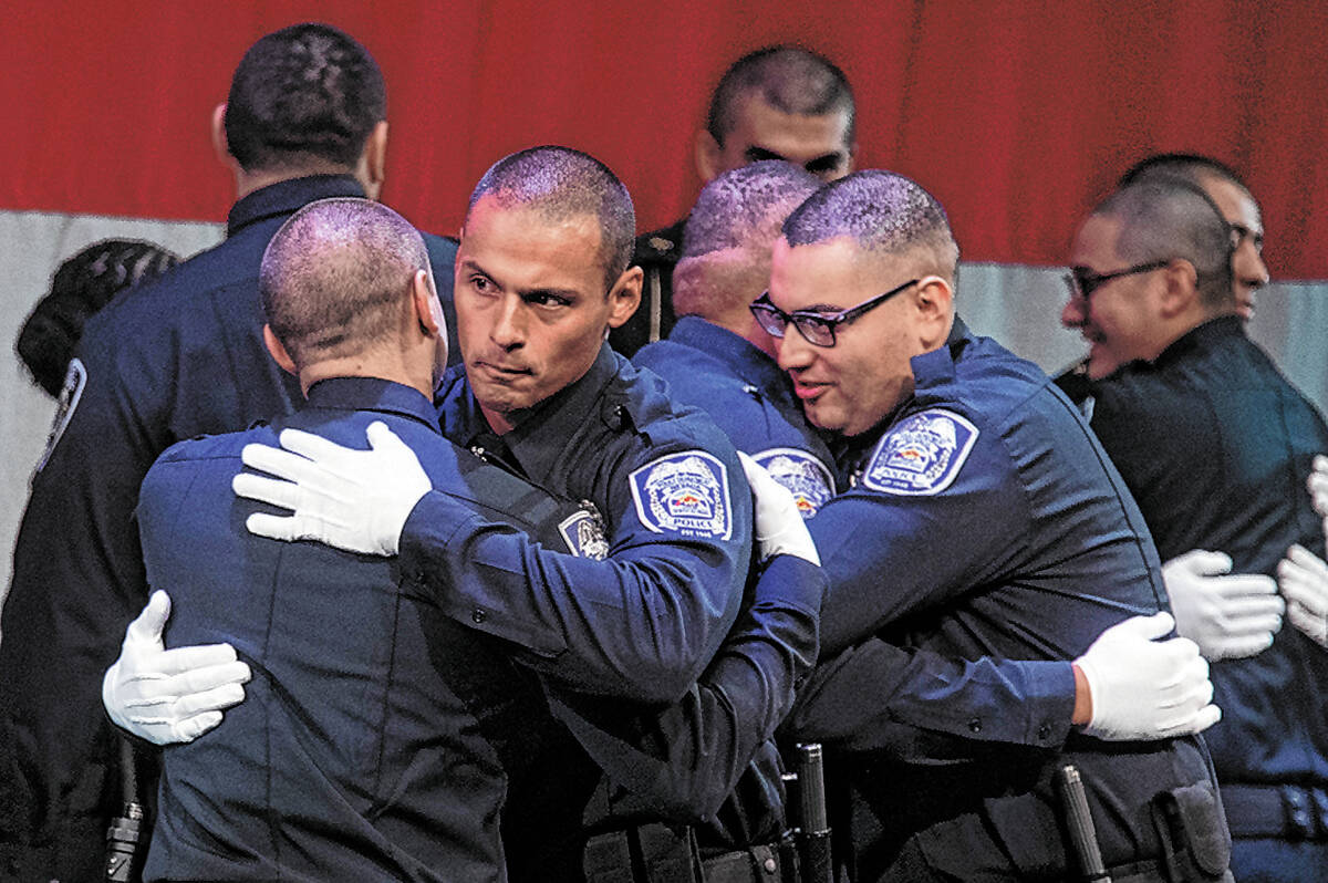 Academy graduates embrace following their Southern Desert Regional Police Academy class of 2022 ...