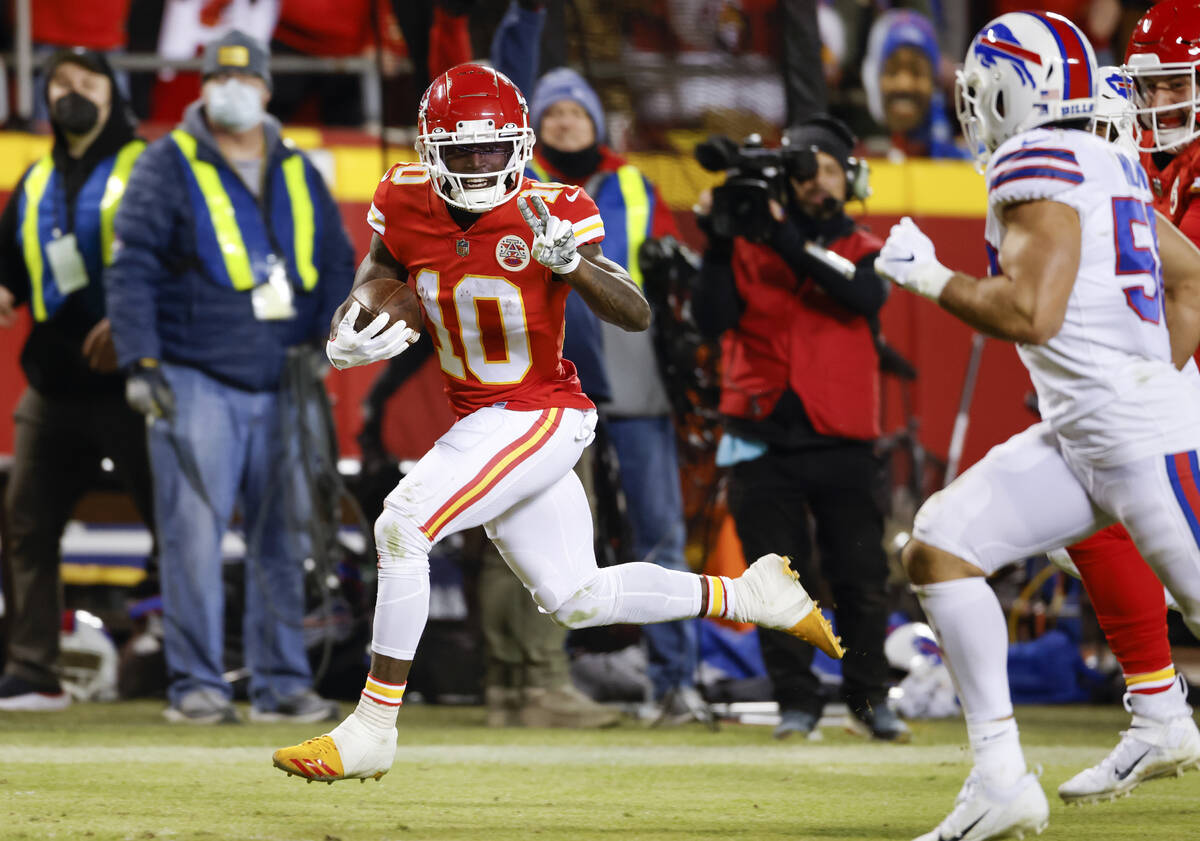Kansas City Chiefs wide receiver Tyreek Hill (10) heads toward the end zone to score on a 64-ya ...