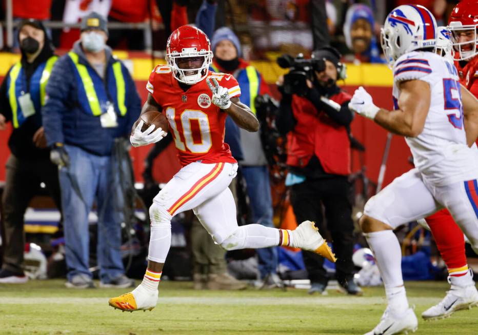 Kansas City Chiefs wide receiver Tyreek Hill (10) heads toward the end zone to score on a 64-ya ...