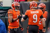 Cincinnati Bengals wide receiver Ja'Marr Chase (1) celebrates with quarterback Joe Burrow (9) a ...
