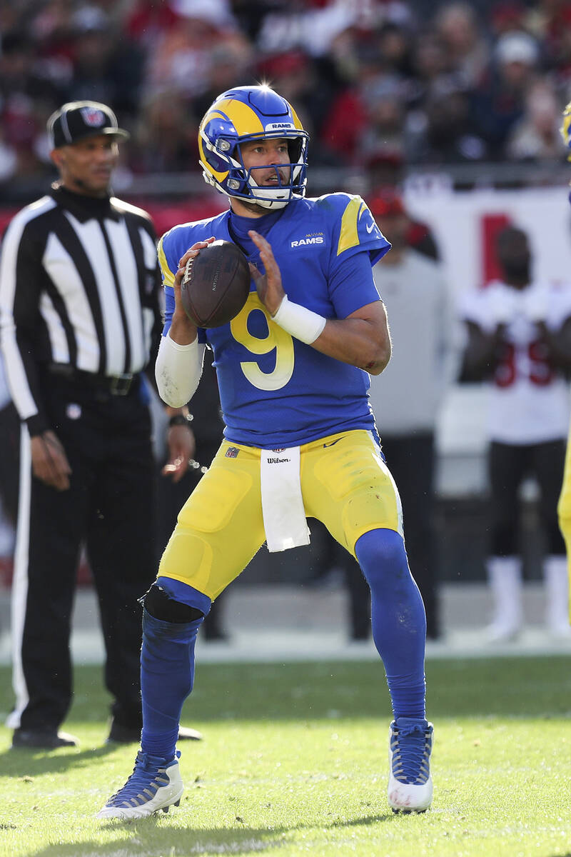 Los Angeles Rams quarterback Matthew Stafford (9) drops back to pass during a NFL divisional pl ...