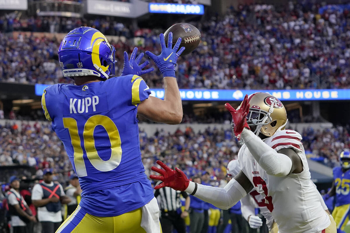 Los Angeles Rams' Cooper Kupp (10) catches a touchdown pass in front of San Francisco 49ers' Ja ...