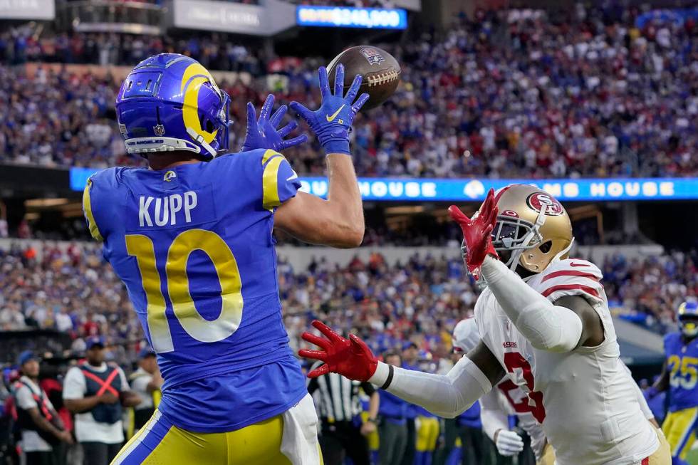 Los Angeles Rams' Cooper Kupp (10) catches a touchdown pass in front of San Francisco 49ers' Ja ...