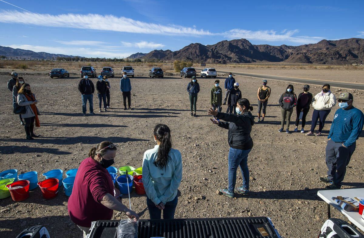 Almendra Johnson, Volunteer Program Director with Get Outdoors Nevada instructs volunteers on c ...
