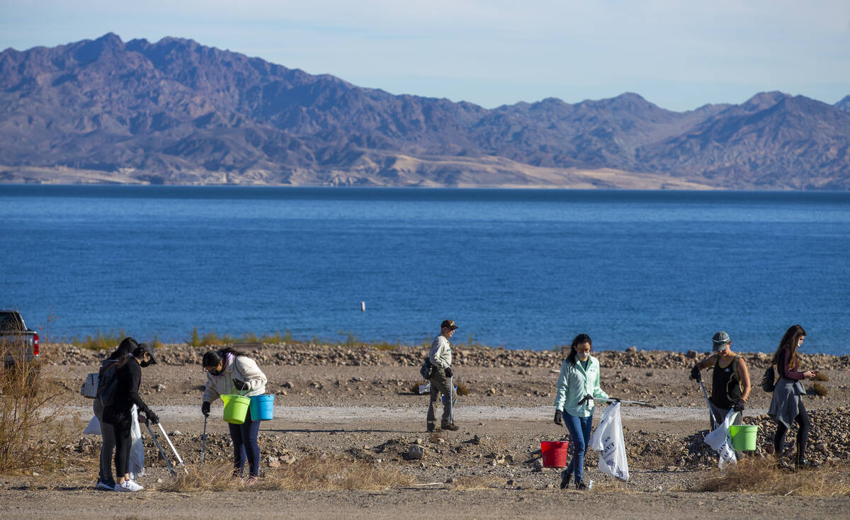 Volunteers comb the shoreline for trash as Evolution Expeditions and Get Outdoors Nevada sponso ...