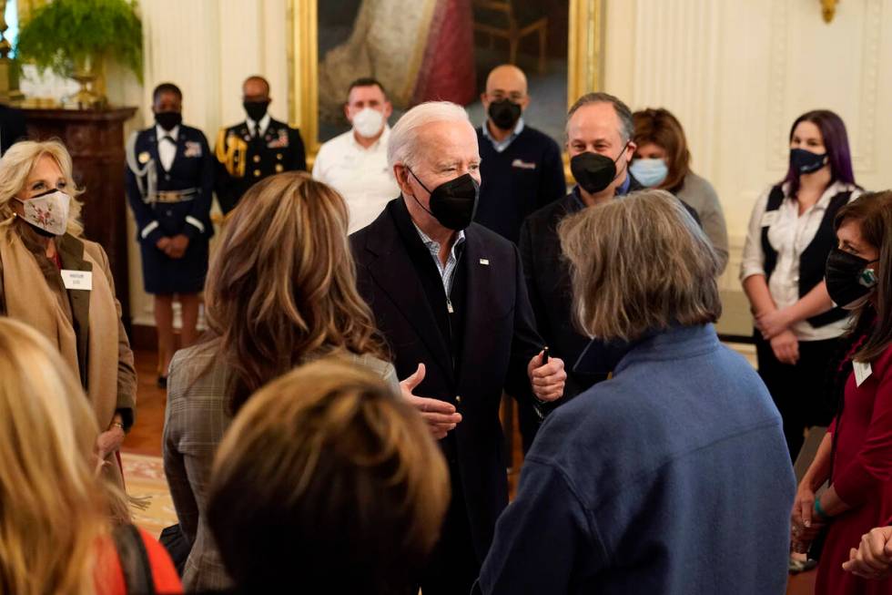 President Joe Biden speaks with spouses of members of the National Governors Association after ...