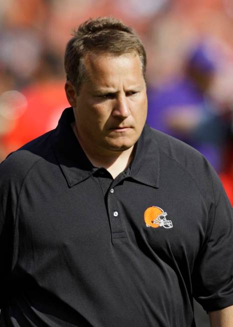 Cleveland Browns coach Eric Mangini walks off the field after a 34-20 loss to the Minnesota Vik ...