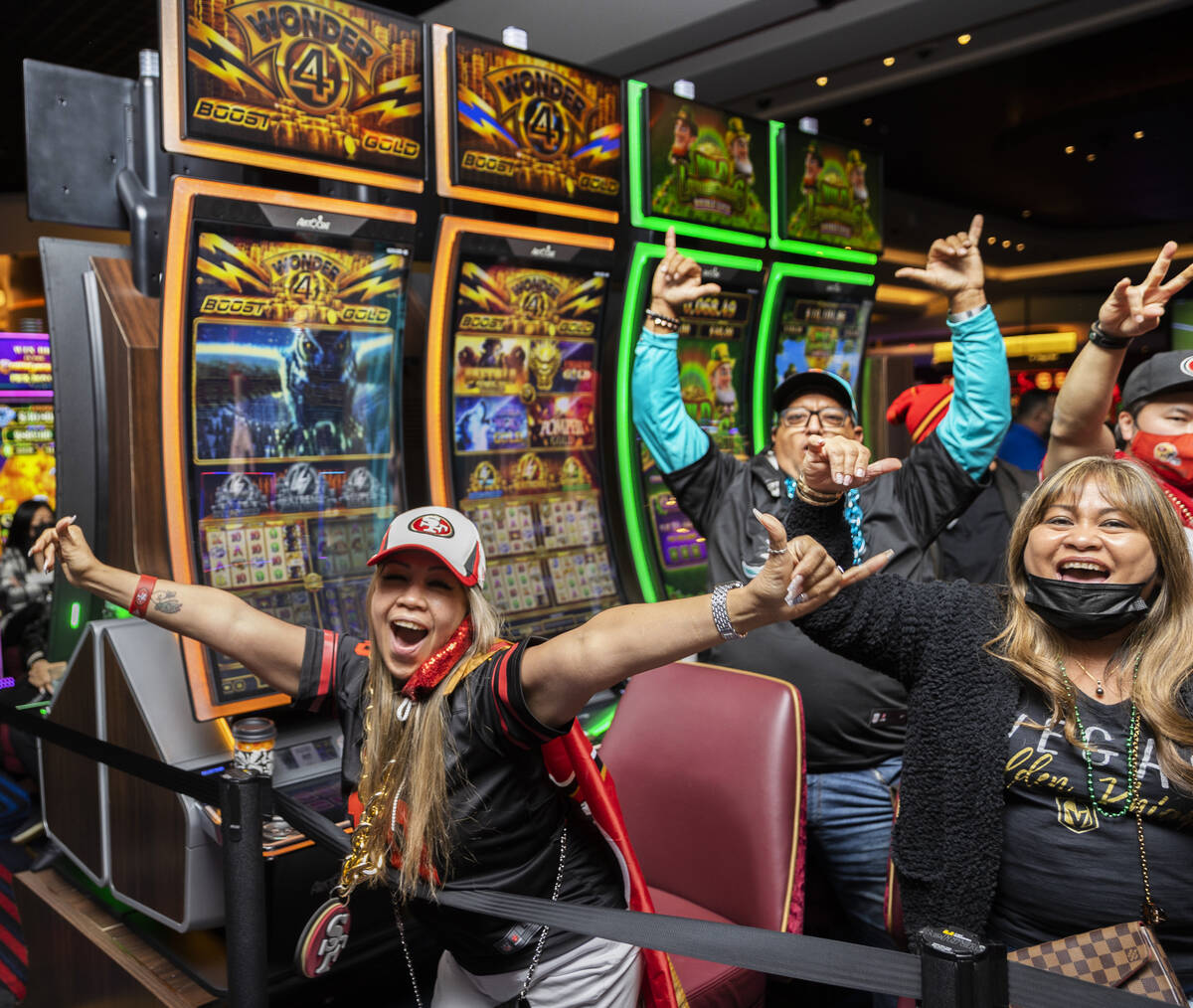 Erynn Lopez, left, from Waipahu, Hawaii, cheers with fellow San Francisco 49ers fans during the ...