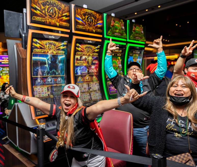 Erynn Lopez, left, from Waipahu, Hawaii, cheers with fellow San Francisco 49ers fans during the ...