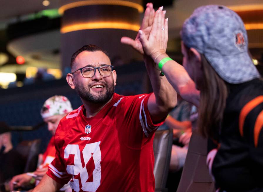 Emigdio Ojeda, left, from Menifee, Calif., celebrates with Steph Boyer, from Denver, Colo., dur ...