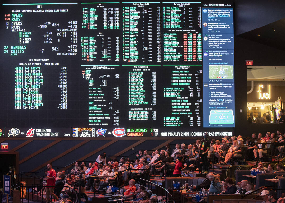 People watch the NFC Championship NFL football game between the San Francisco 49ers and Los Ang ...