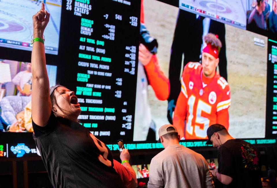 Bengals fan Steph Boyer, right, from Denver, Colo., cheers for Cincinnati during the AFC Champi ...