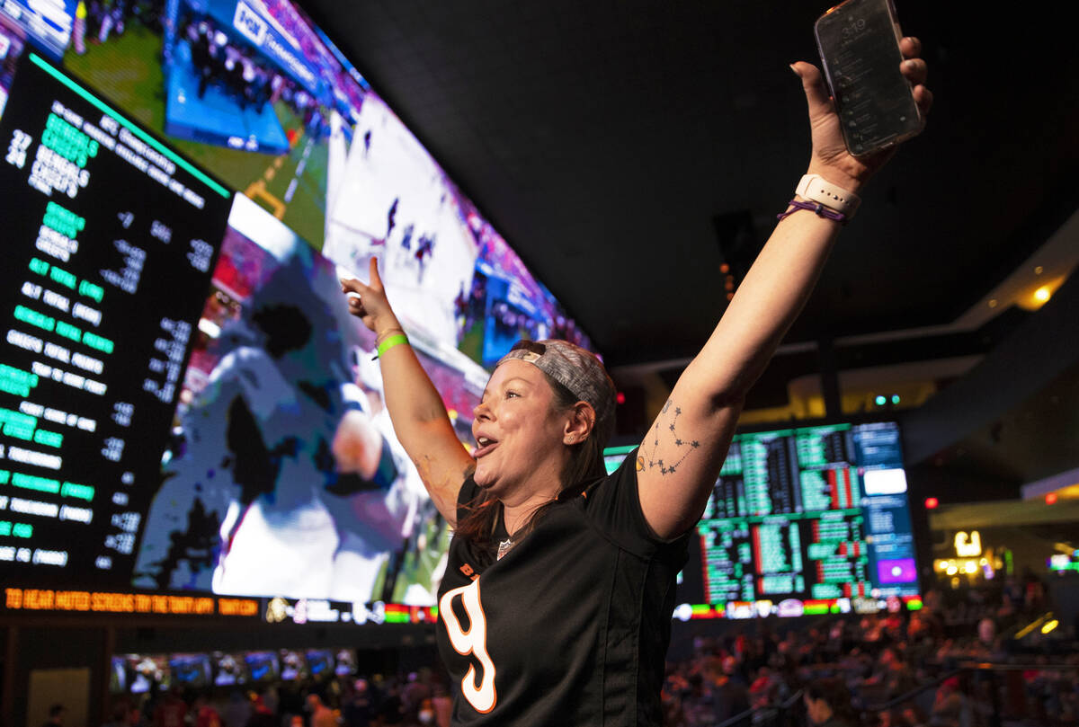 Bengals fan Steph Boyer, from Denver, Colo., cheers for Cincinnati during the AFC Championship ...