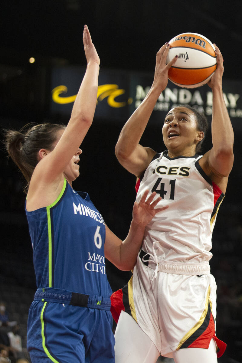 Las Vegas Aces center Kiah Stokes (41) snags the ball away from the Minnesota Lynx while Minnes ...