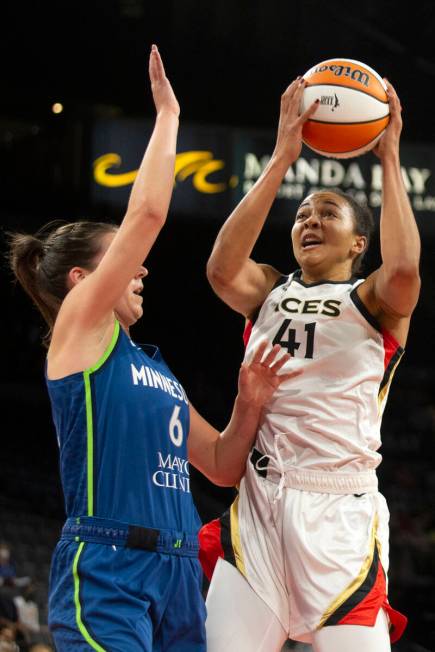 Las Vegas Aces center Kiah Stokes (41) snags the ball away from the Minnesota Lynx while Minnes ...