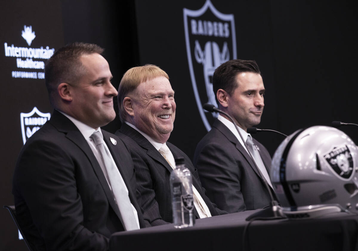 Raiders head coach Josh McDaniels, left, Raiders owner Mark Davis and Raiders general manager D ...