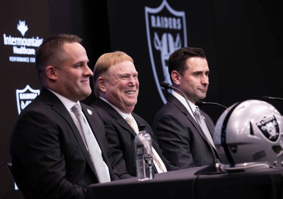 Raiders head coach Josh McDaniels, left, Raiders owner Mark Davis and Raiders general manager D ...