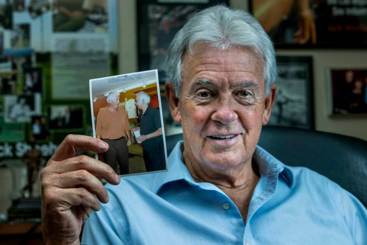 Author Jack Sheehan in his home office with a photo of legendary former drug kingpin Jimmy Chag ...