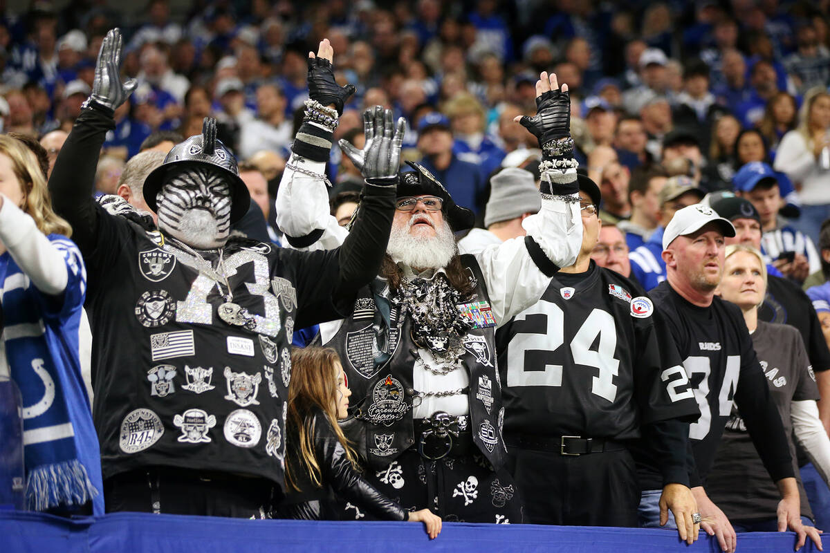 Fans react after a play during an NFL football game between the Raiders and the Indianapolis Co ...