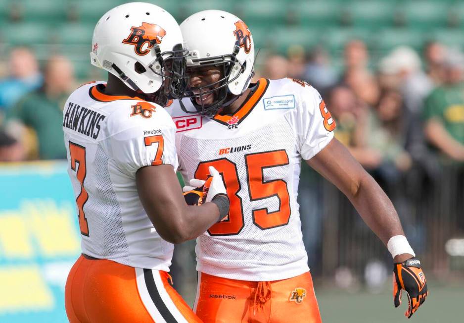 B.C. Lions' Lavelle Hawkins, left, and Shaquille Murray-Lawrence celebrate a touchdown against ...