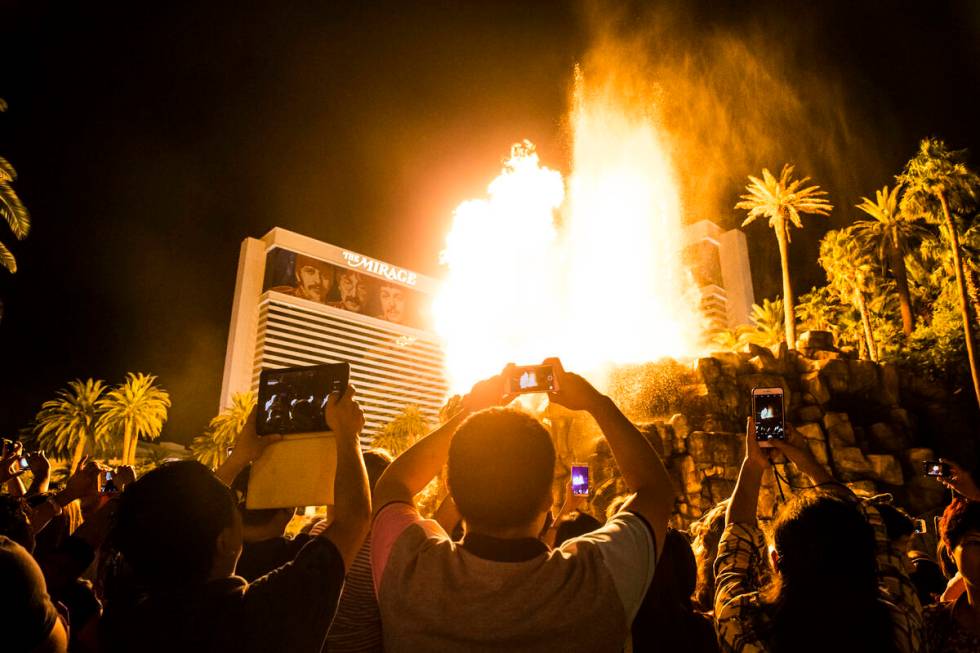 A large crowd gathers to watch the volcano at The Mirage on the Strip on Tuesday, Oct. 11, 2016 ...