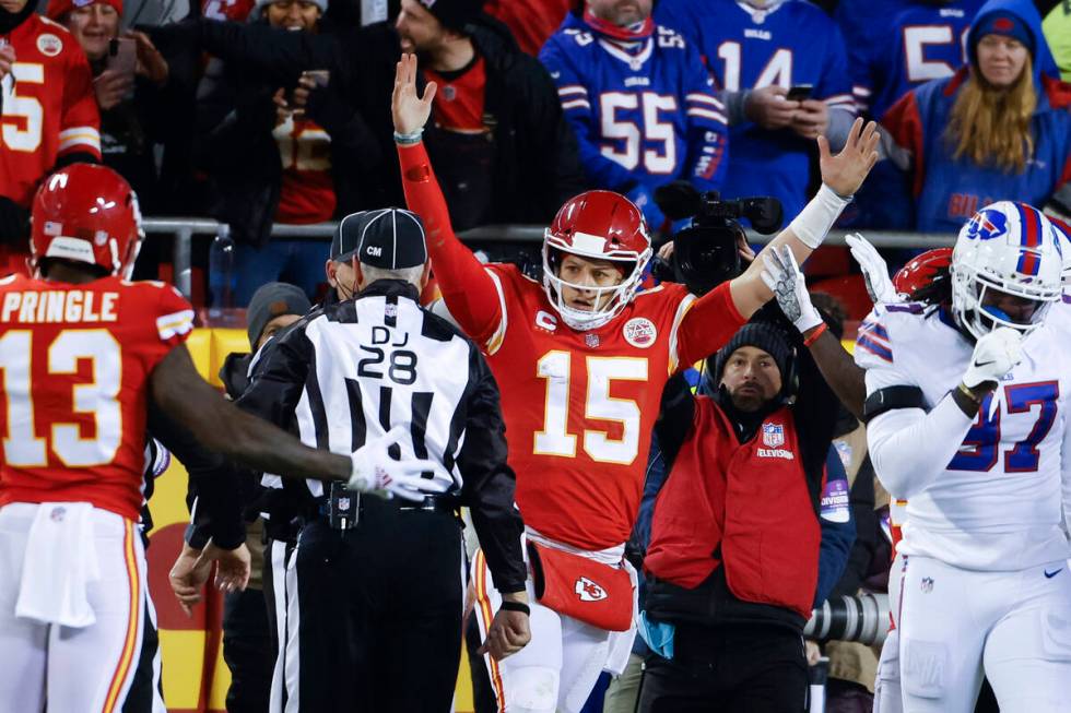 Kansas City Chiefs quarterback Patrick Mahomes (15) reacts after scoring on an 8-yard touchdown ...