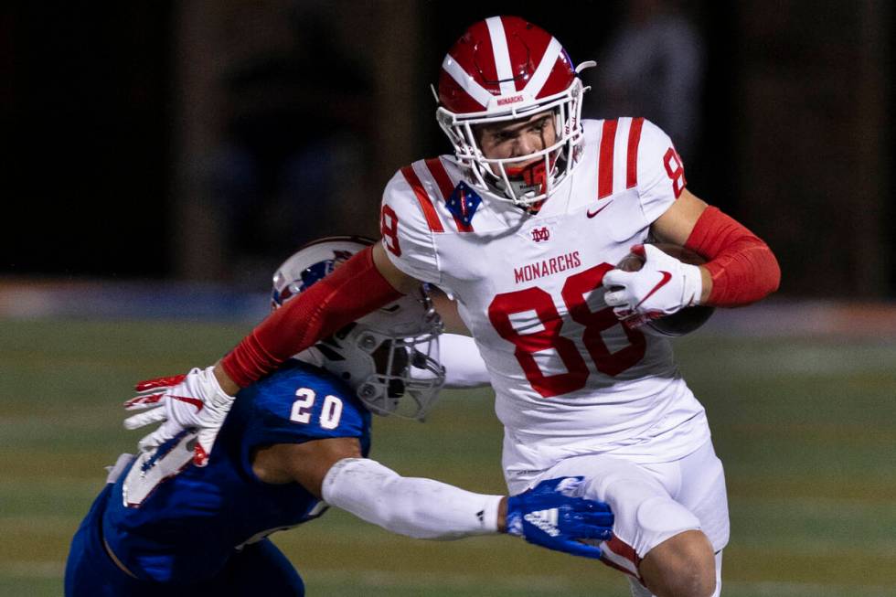 Liberty High safety Saco Alofipo (20) tries to take down Mater Dei High wide receiver Jack Ress ...